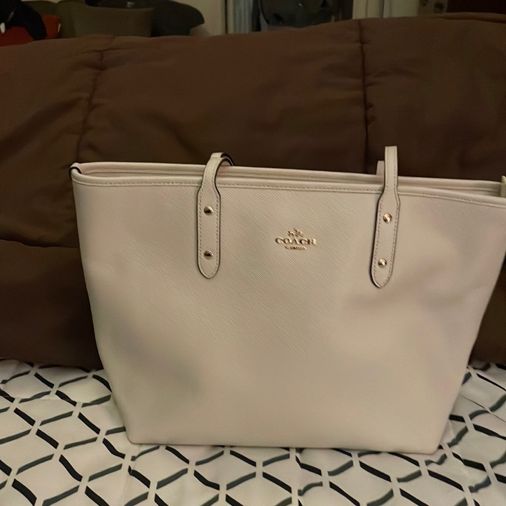 White leather coach purse.